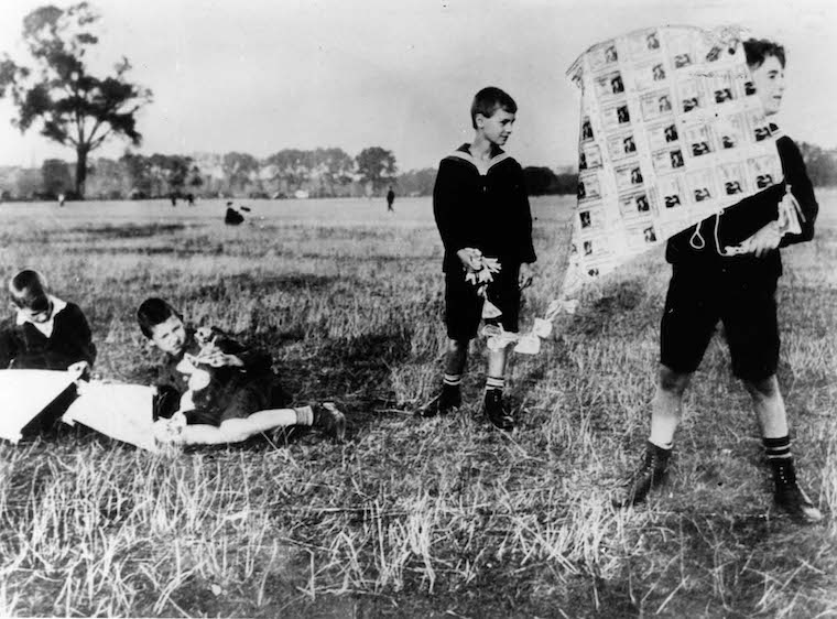 German boys making a kite out of reichsmarks